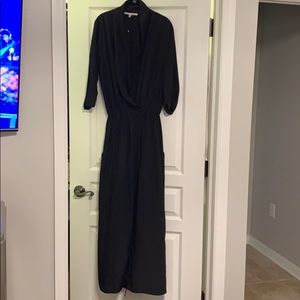 Black jumpsuit.Snaps in front w/ drawstring waist